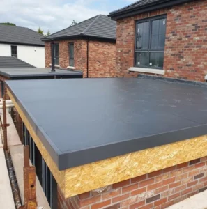Flat roof on brick building under construction.