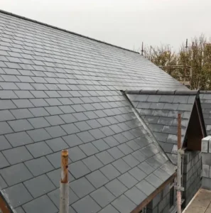 Slate roof with wooden scaffolding structure.